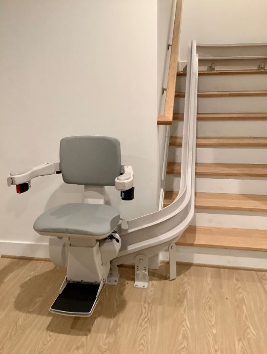 curved stairlift installed onto stairs, not the wall