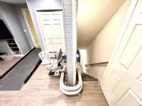 curved-stairlift-with-top-rail-overrun-in-West-Chester-Ohio-home.jpg