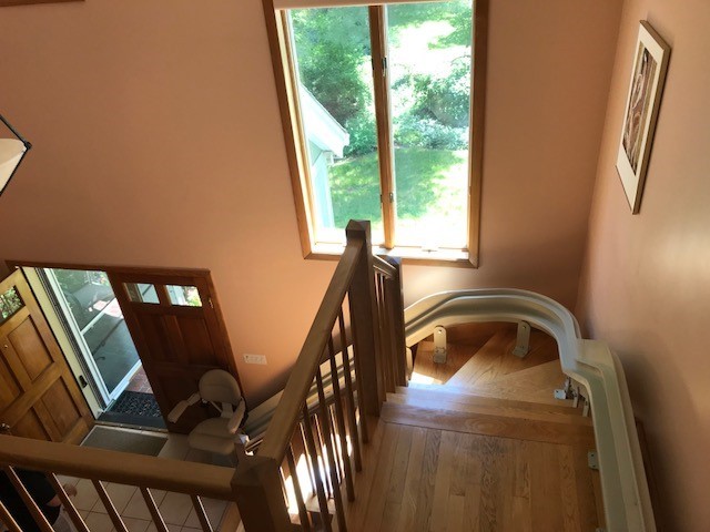 view of curved stairlift from top landing in Massachusetts home