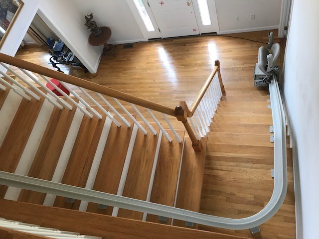 view of curved stairlift from upper level of Massachuetts home