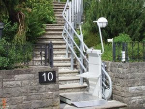 Inclined Platform Lift installed on an outdoor staircase